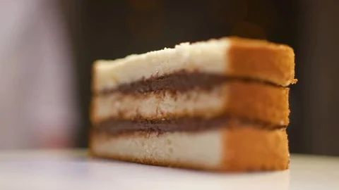 A piece of cake rotates around its axis Stock Footage 119856773