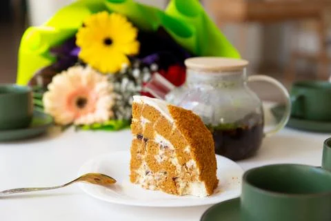 A piece of cake stands on the table. Stock Photos