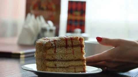 Piece of cake on the table in cafe. People in cafe - detail 스톡 동영상 49761350