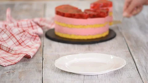 Piece of cake with a vanilla biscuit, raspberry mousse and jelly, sweet pastries Stock Footage 128737664