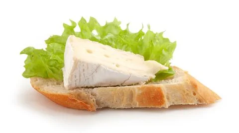 Piece of camembert on the bread Stock Photos