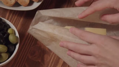 Piece of cheese, bread olive and greens Stock Footage 73919268