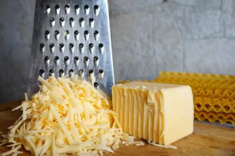A piece of cheese grated Stock Photos
