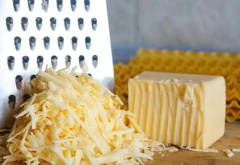 A piece of cheese grated Stock Photos