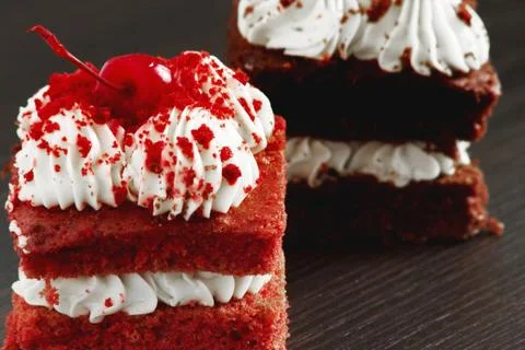 Piece of a cherry cake with cherry and whipped cream cakes chocolate cake Stock Photos