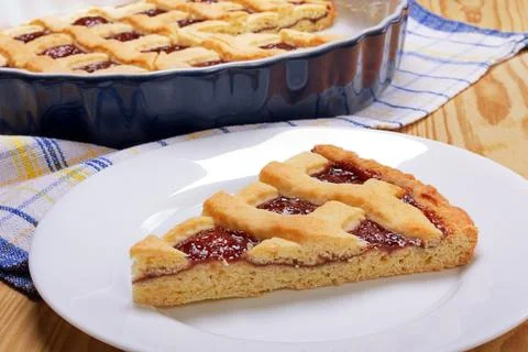 Piece of cherry pie on white table. 库存照片