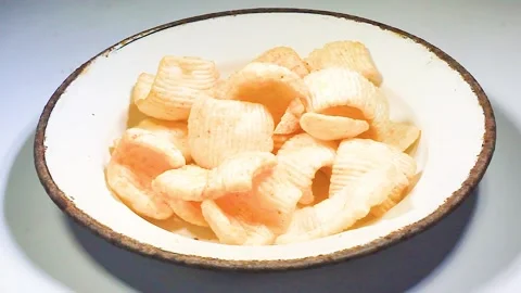 Piece of chips on a white plate isolated on a white background Chips isolated Stock Footage 169340023