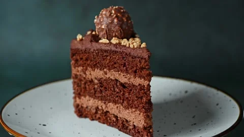Piece of chocolate cake. Cake rotating. Chocolate dessert. Coffee cake on white  Stock Footage 170387705