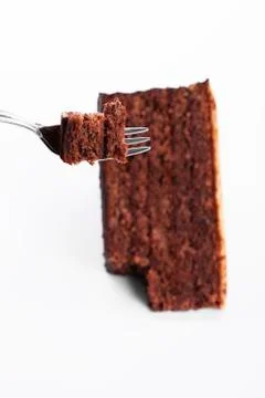 Piece of a chocolate cake on a fork Stock Photos