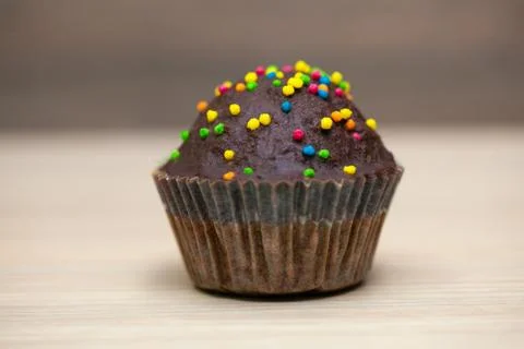 A piece of chocolate cake with mint on the table, close-up Stock Photos