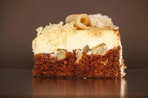 A piece of chocolate cake with mint on the table, close-up Foto stock