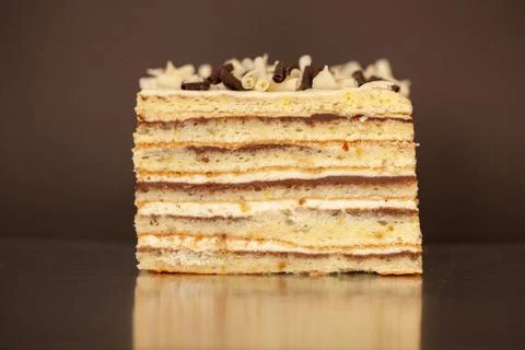 A piece of chocolate cake with mint on the table, close-up Stock Photos