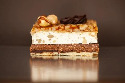 A piece of chocolate cake with mint on the table, close-up Stock Photos