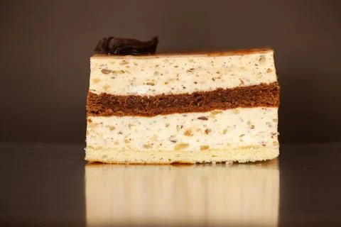 A piece of chocolate cake with mint on the table, close-up Stock Photos