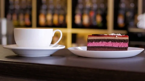 Piece of chocolate mousse cake with a cup of coffee. Stock Footage 105646416