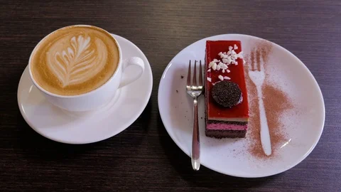 Piece of chocolate mousse cake with a cup of coffee. Top view. Stock Footage 106816880