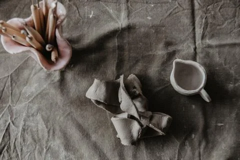 A piece of clay on table. Handmade craft background Stock-Fotos
