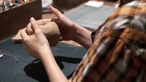 Piece of clay in young lady hands. Ceramic workshop Stock Footage 201568396