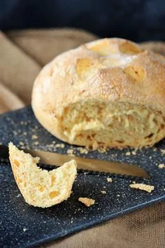 Piece of corn white bread cut from a loaf Stock Photos