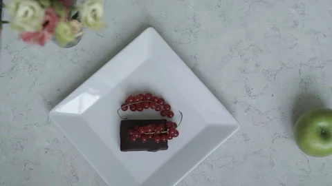 A piece of currant cake with a cap of tea Stock Footage 98786086