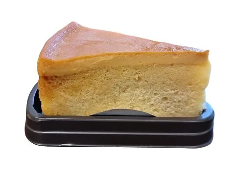 A piece of Custard Cake. isolate white background. Stock Photos