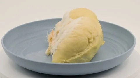 A piece of durian on a plate Stock Footage 235366497