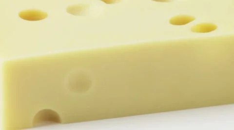 A piece of Emmental cheese Stock Footage 8571382