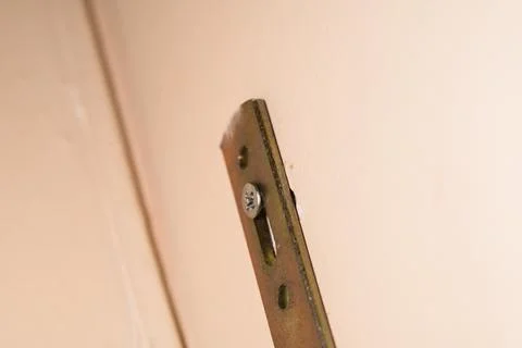 Piece Fixed to the Wall with Screw Stock Photos