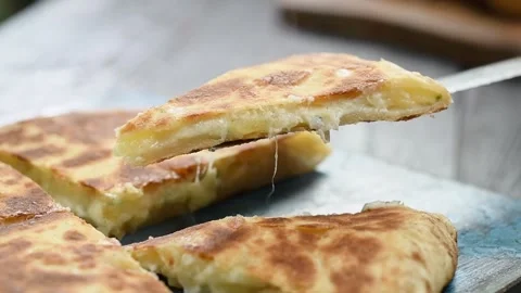 Piece of flat bread with potatoes and cheese. Stock Footage 246860871