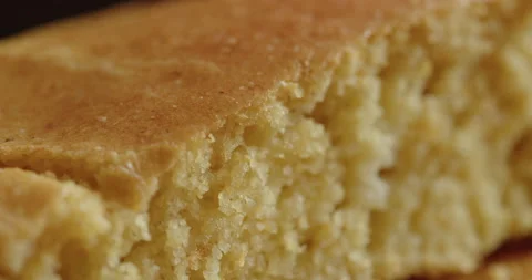 Piece of gluten-free cornbread slice 4K video Stock Footage 251237131