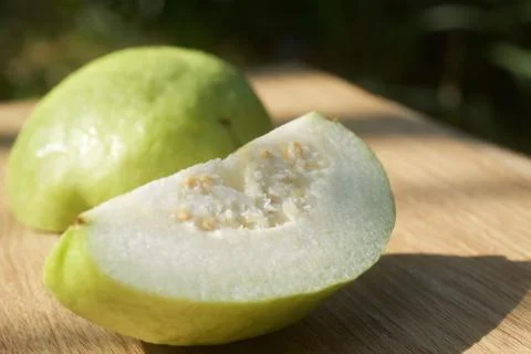 Piece of guava on table Stock Photos