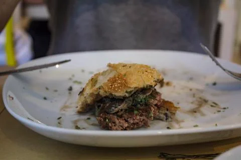 Piece of hamburger on a plate Stock Photos