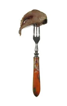 A piece of herring on the old fork with a colored pen, isolated on white back Stock Photos