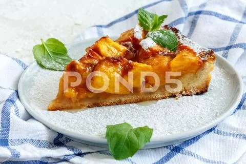 Piece of homemade peach pie. Stock Photos