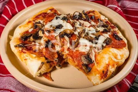 A piece of homemade pizza. Stock Photos