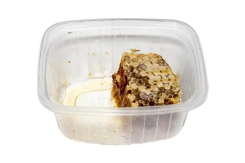 A piece of honeycomb isolated on a white background. Stock Photos