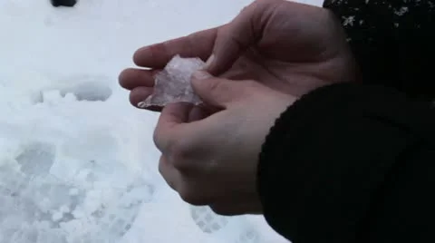 Piece of ice in the hands Stock-Footage 10770257