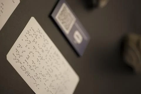 Piece identified with QR code and Braille text Stock Photos