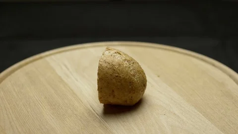 A piece of integral bread on a wooden board Stock Footage 106754237