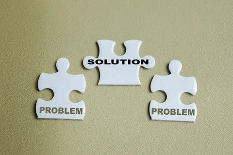 Piece of jigsaw puzzle with problem and solution. Stock Photos