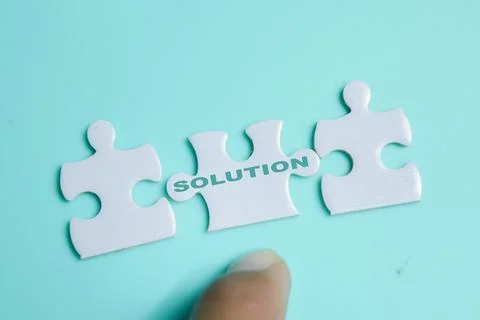 Piece of jigsaw puzzle with solution. Stock Photos
