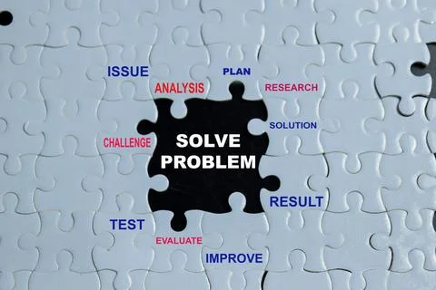 Piece of jigsaw puzzle with word solve problem. Stock Photos