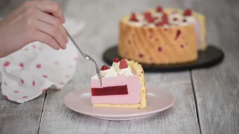 Piece of Layered Raspberry Mousse Cake. Stock Footage 149939013