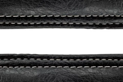 A piece of leather stitched with threads on a white background with free spac Stock Photos