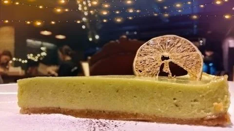 A piece of lemon sponge cake on a plate, dessert at restorant Stock Photos