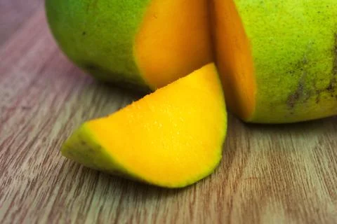 Piece of mango on table Stock Photos
