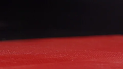 Piece of meat being thrown at a cutting board Stock Footage 128822311