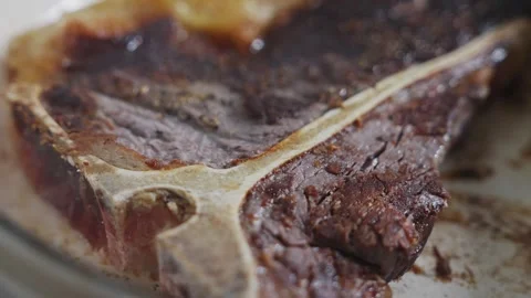 A piece of meat is brown and has a lot of seasoning on it Stock Footage 305647698
