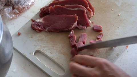 Piece of meat is cut with knife Stock Footage 117278381