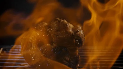 A piece of meat falls on the grill Stock Footage 118134469